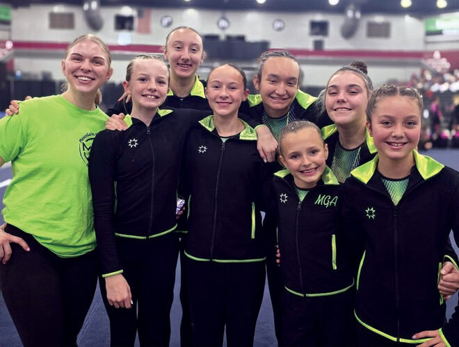 Submitted photos Mountaineer Gymnastics Academy Coach Tori Chambers with Xcel Platinum and Diamond gymnasts.